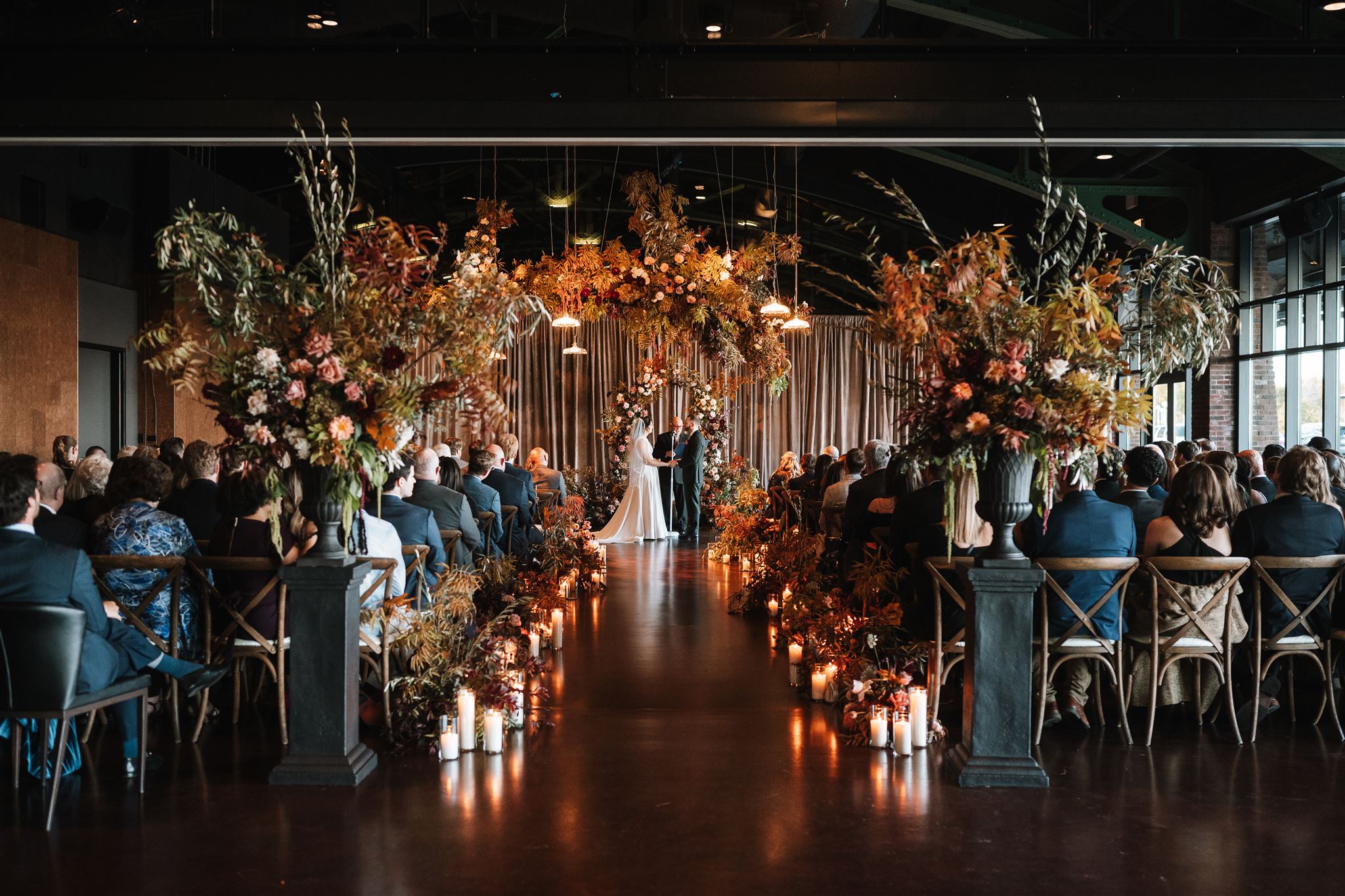 moody autumn wedding ceremony at theater on the lake in chicago