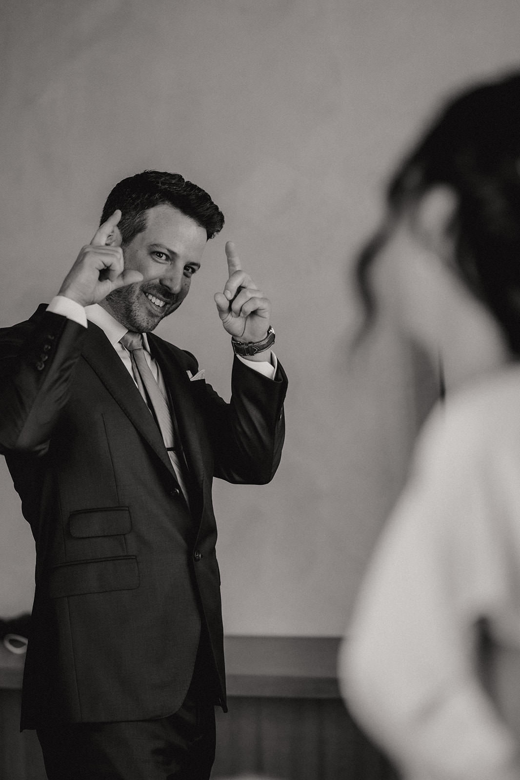 groom does a camera motion during their first look on their wedding day