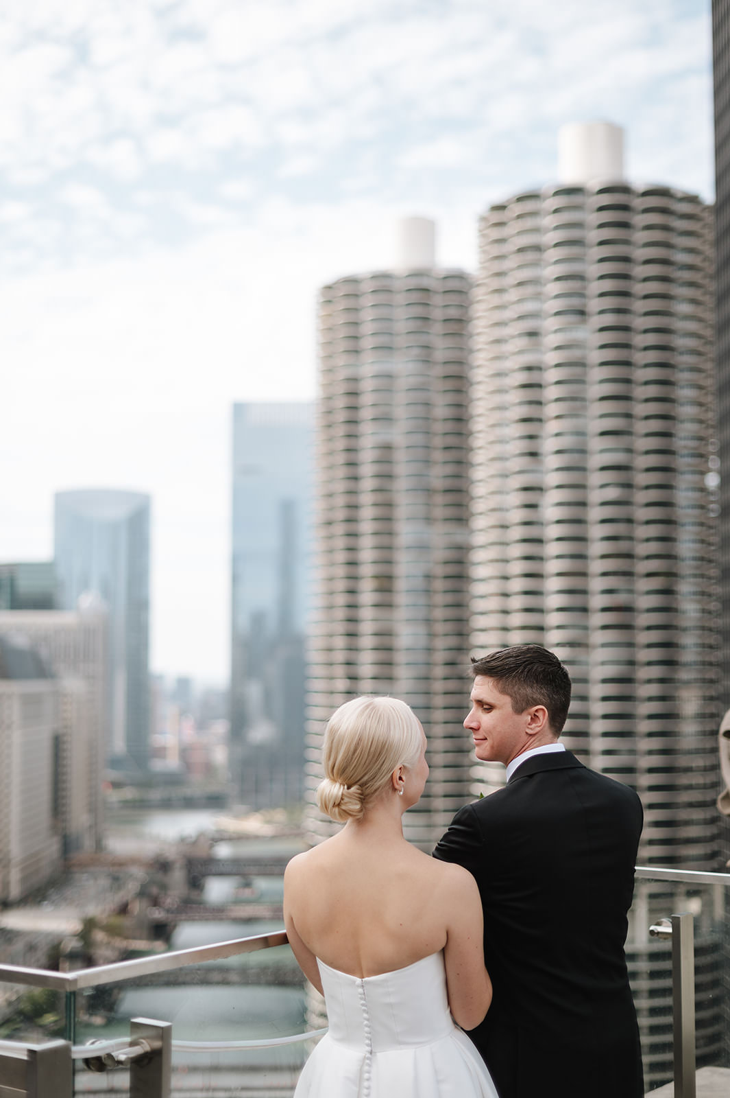 Documentary wedding moment at LondonHouse Rooftop overlooking downtown Chicago