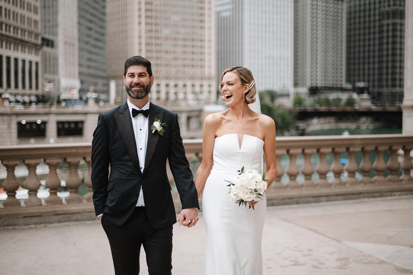 Candid wedding photography of a couple walking hand in hand in Chicago with natural movement and genuine emotion