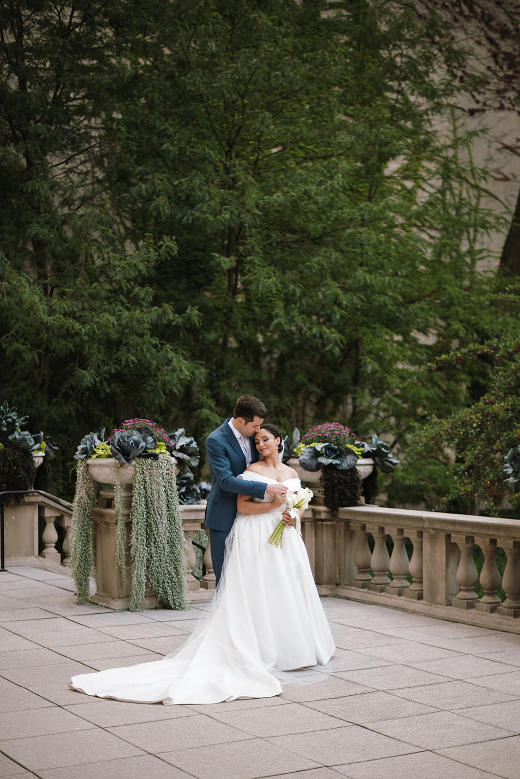 Editorial wedding portrait of a couple in natural light at the Art Institute Chicago Gardens with an elegant, timeless style
