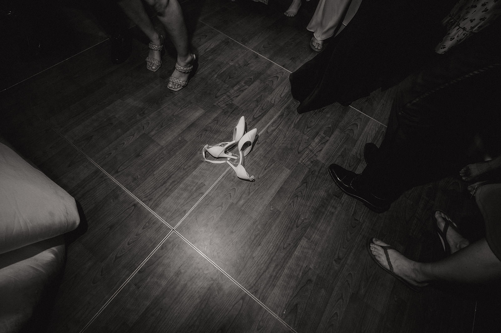Wedding shoes on the dance floor at the end of the night captured with full day coverage